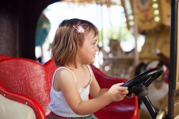 girl in carousel car