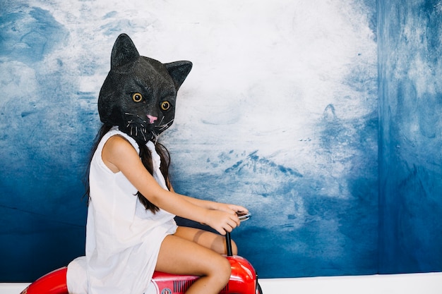 Free photo girl in cat halloween mask