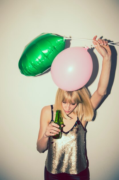 Girl at crazy partty with balloons