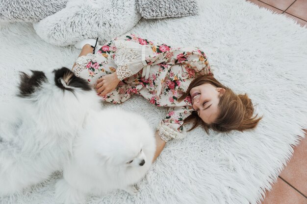 Girl and cute white puppies