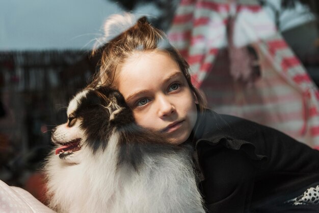 Girl and dog inside the house