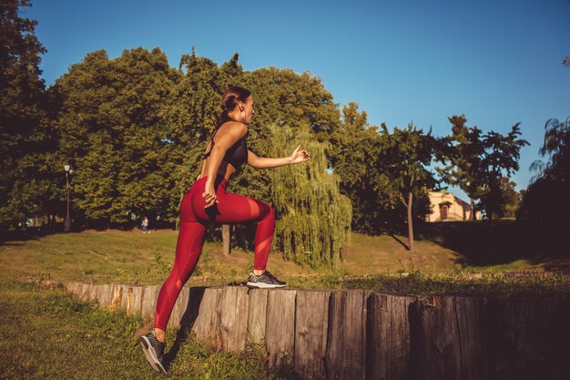 Girl doing exercise in the park