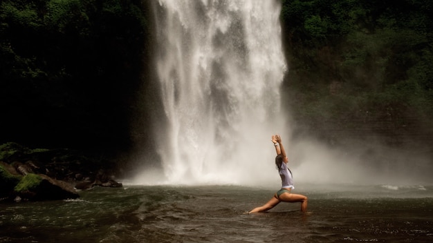 Girl doing yoga in an open country