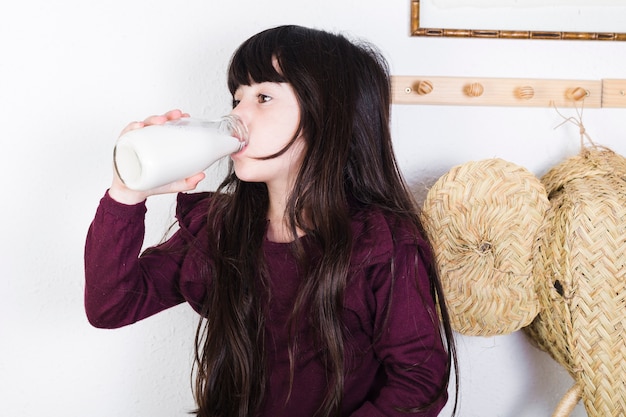 Free Photo girl drinking milk from bottle