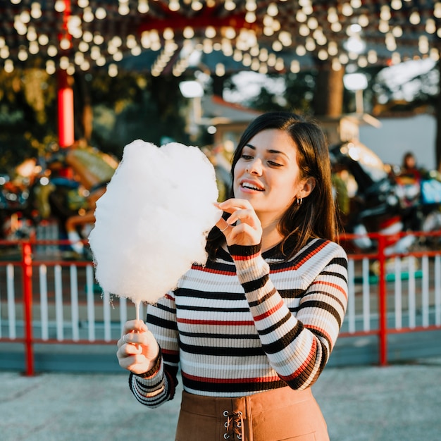 Girl eating cotton candy