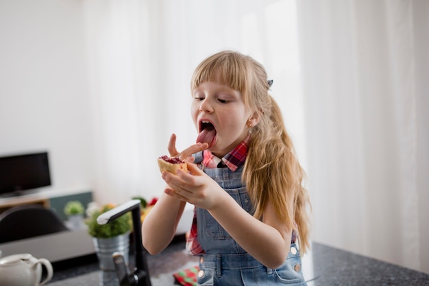 Free Photo girl eating open sandwich