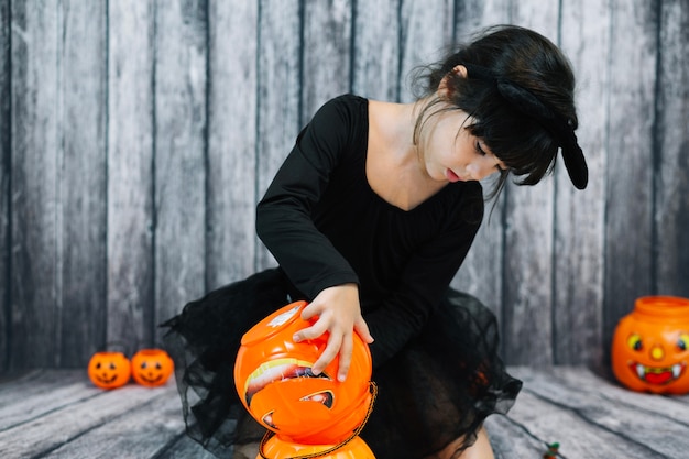 Free Photo girl emptying basket