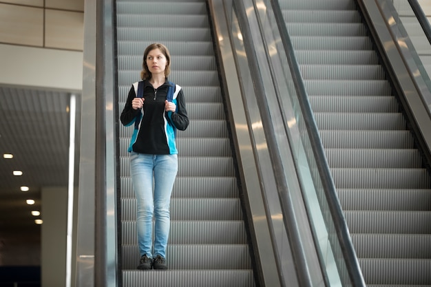 Free photo girl on escalator