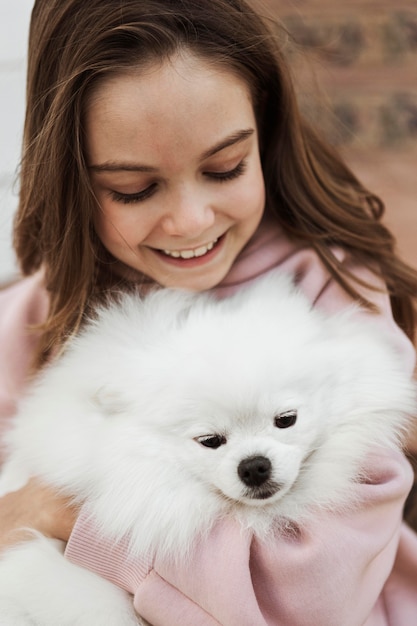 Girl and fluffy dog high view