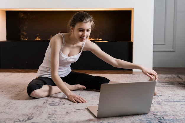 Free photo girl following instruction to work out at home