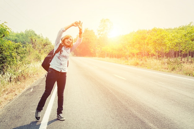 Free photo girl gesturing to a car