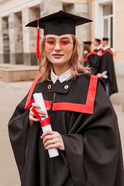 Girl at graduation with diploma