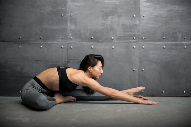 Girl in gym doing yoga