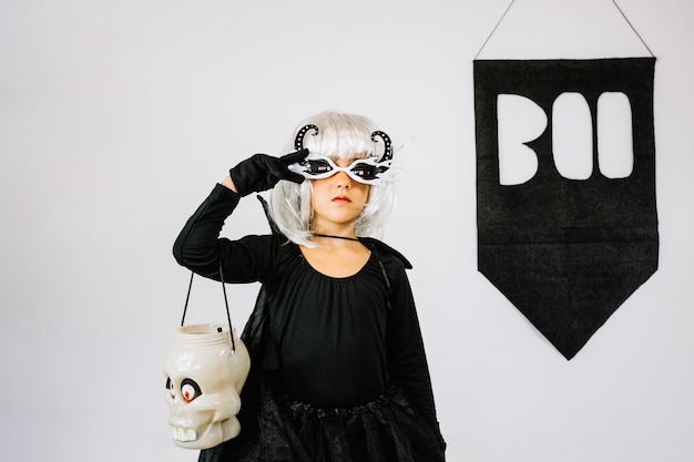 Free Photo girl in halloween costume showing peace sign