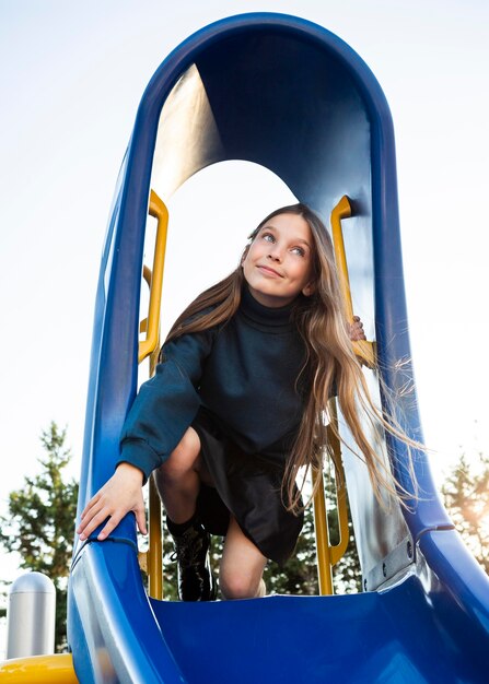 Girl having fun on a slide