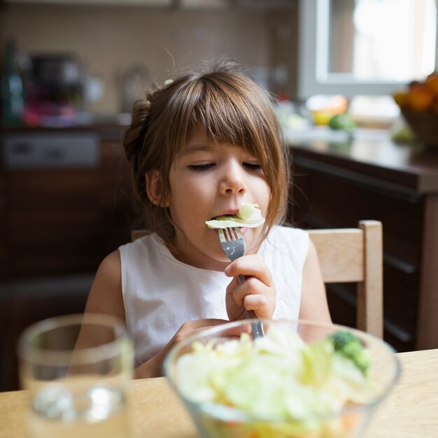 Girl having healthy meal at home 