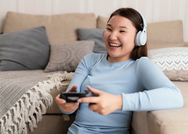 Girl holding controller medium shot