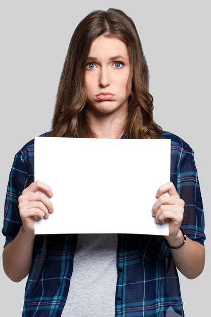 Girl holding white billboard