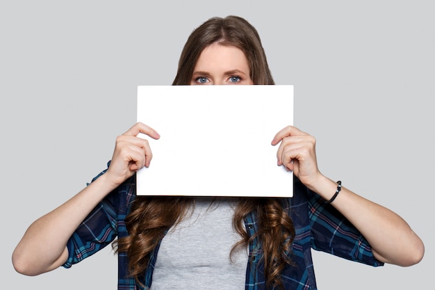 Girl holding white billboard