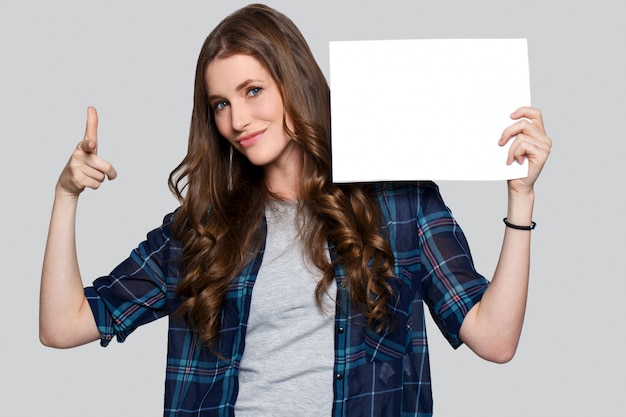 Girl holding white billboard