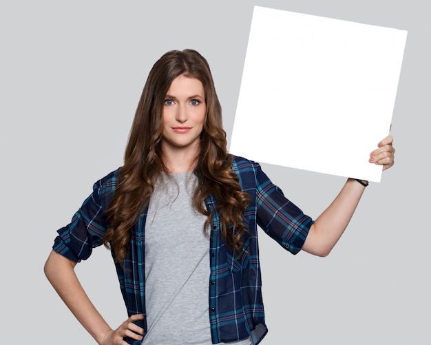 Girl holding white billboard