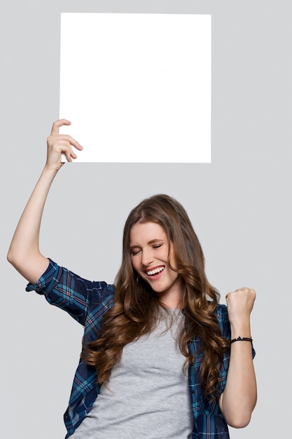 Girl holding white billboard