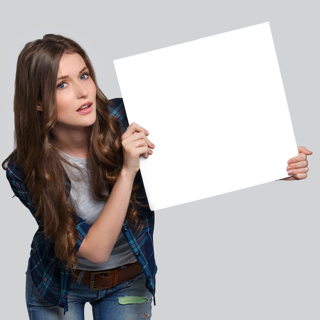 Girl holding white billboard