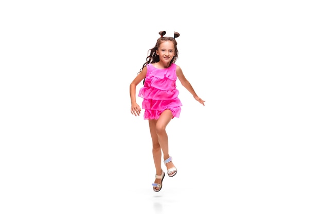 Girl jumping and running isolated on white