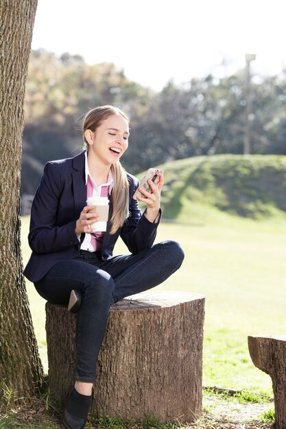 Girl laughing with her mobile