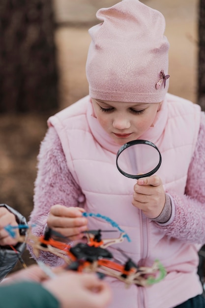 Girl learning science in the nature