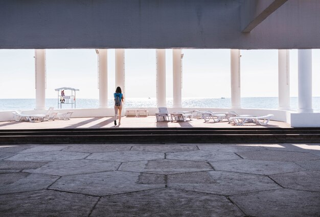 A girl looking at the sea