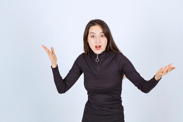 Girl making enthusiastic speech using body language on the scene. 