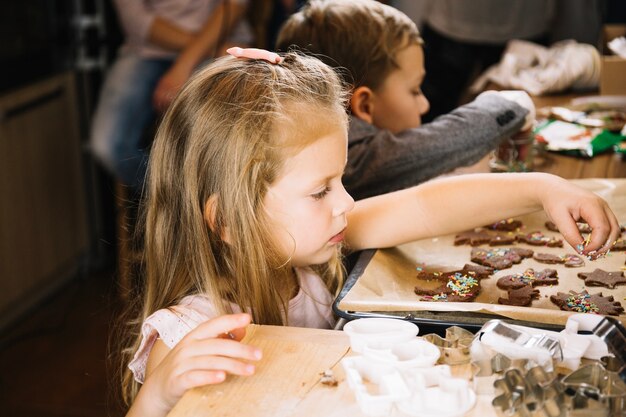 Girl making gingerbread for christmas