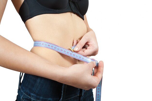 Girl measuring waist