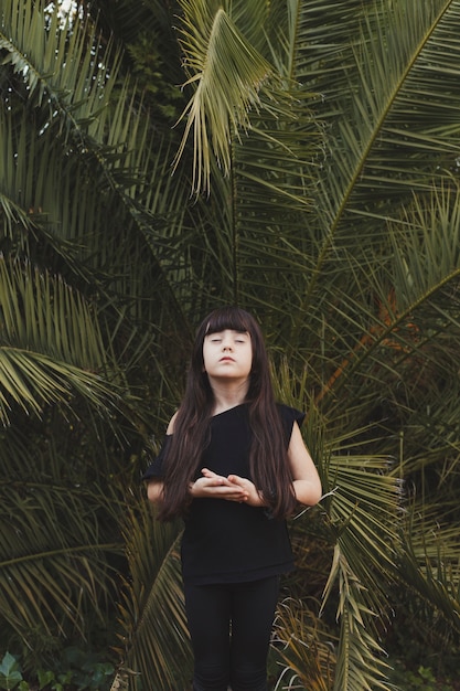 Girl meditating with closed eyes