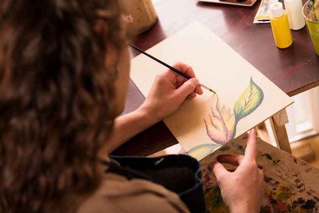 Free Photo girl painting a canvas