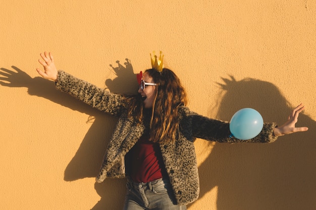 Free photo girl in paper crown having fun