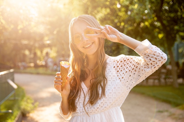 Free Photo girl in park eating ice cream