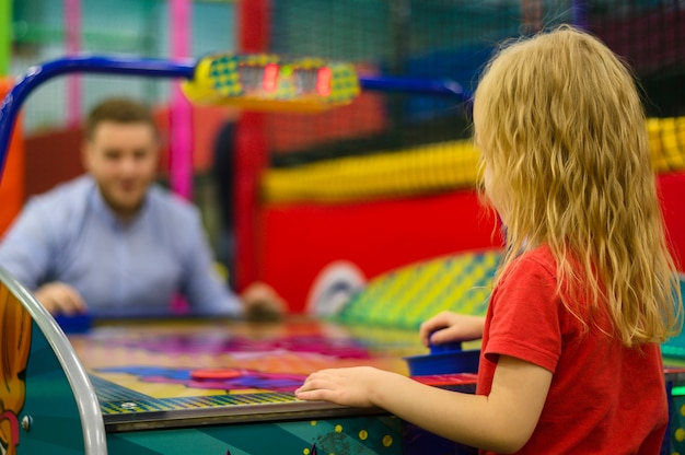 Free photo girl playing air flow hockey