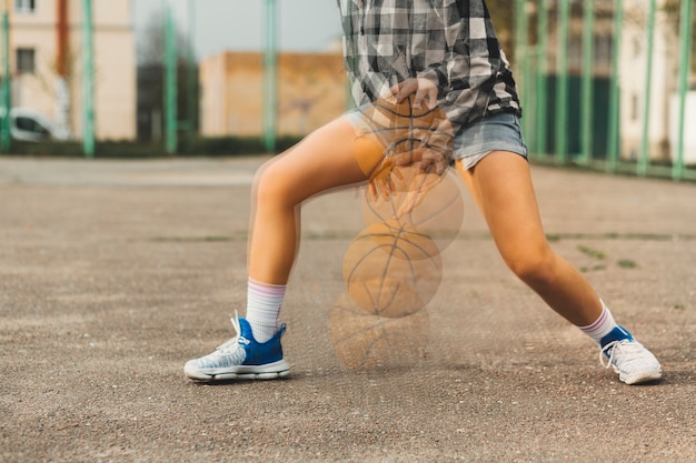 Free photo girl playing basketball