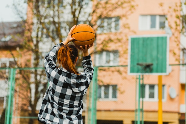 Free Photo girl playing basketball