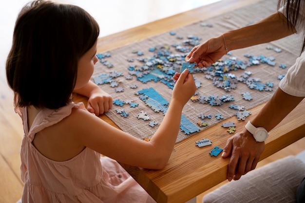 Girl playing with brain teaser toys