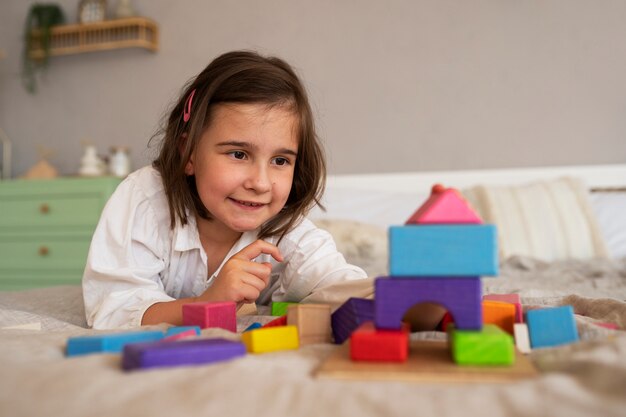 Girl playing with brain teaser toys