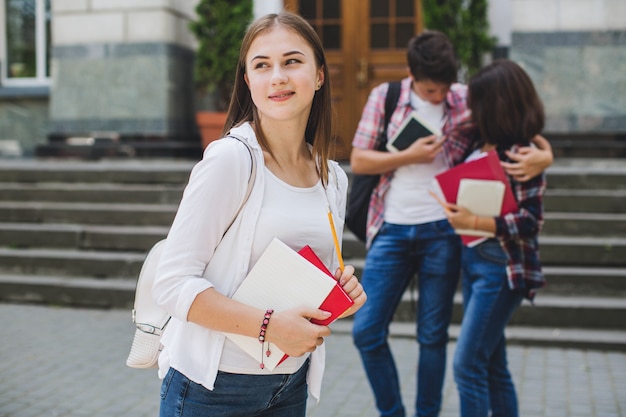 Girl posing on background of couple