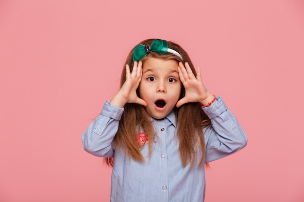 girl posing with eyes and mouth wide open being emotional and surprised