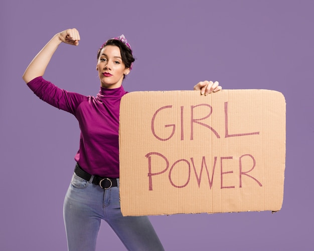 Girl power lettering on cardboard and woman