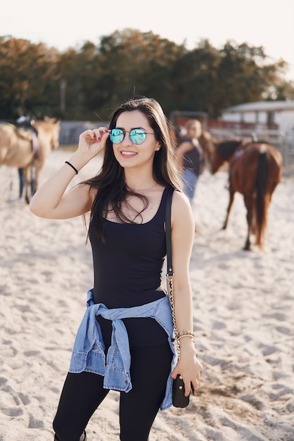 Free photo girl preparing to ride a horse