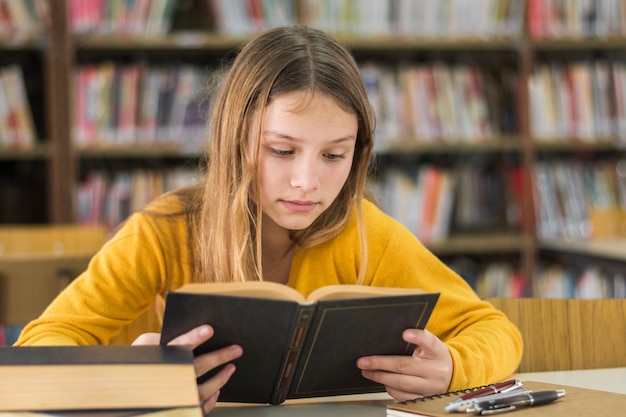 Free photo girl reading in school library