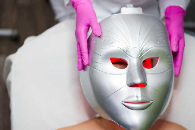 Girl receiving facial treatment in a beauty salon