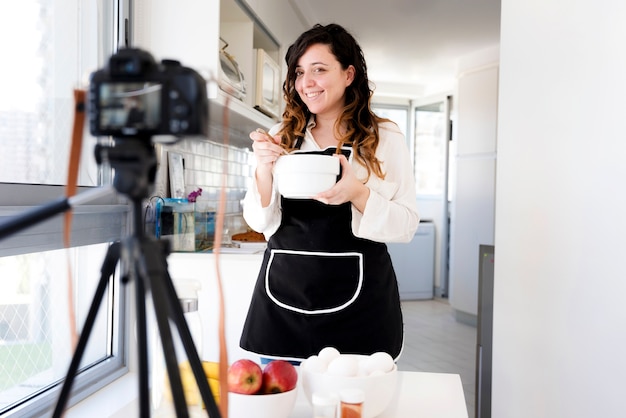 Free photo girl recording a recipe